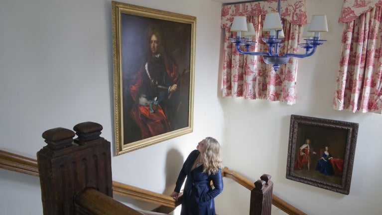 Curator Katherine Carter with the restored Marlborough portrait